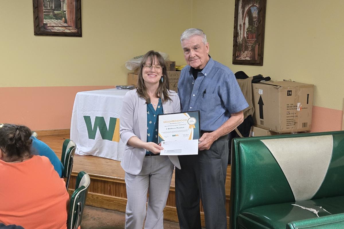 DeWayne Hardage accepting Grant from Misty Adams of Waste Management